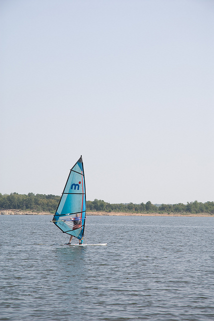 someone windsurfing on the lake