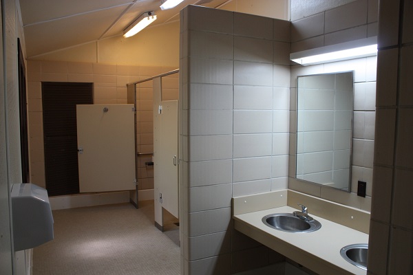 two sinks and shower stalls