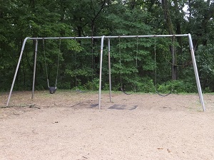 a swing set with one baby swing and two regular swings
